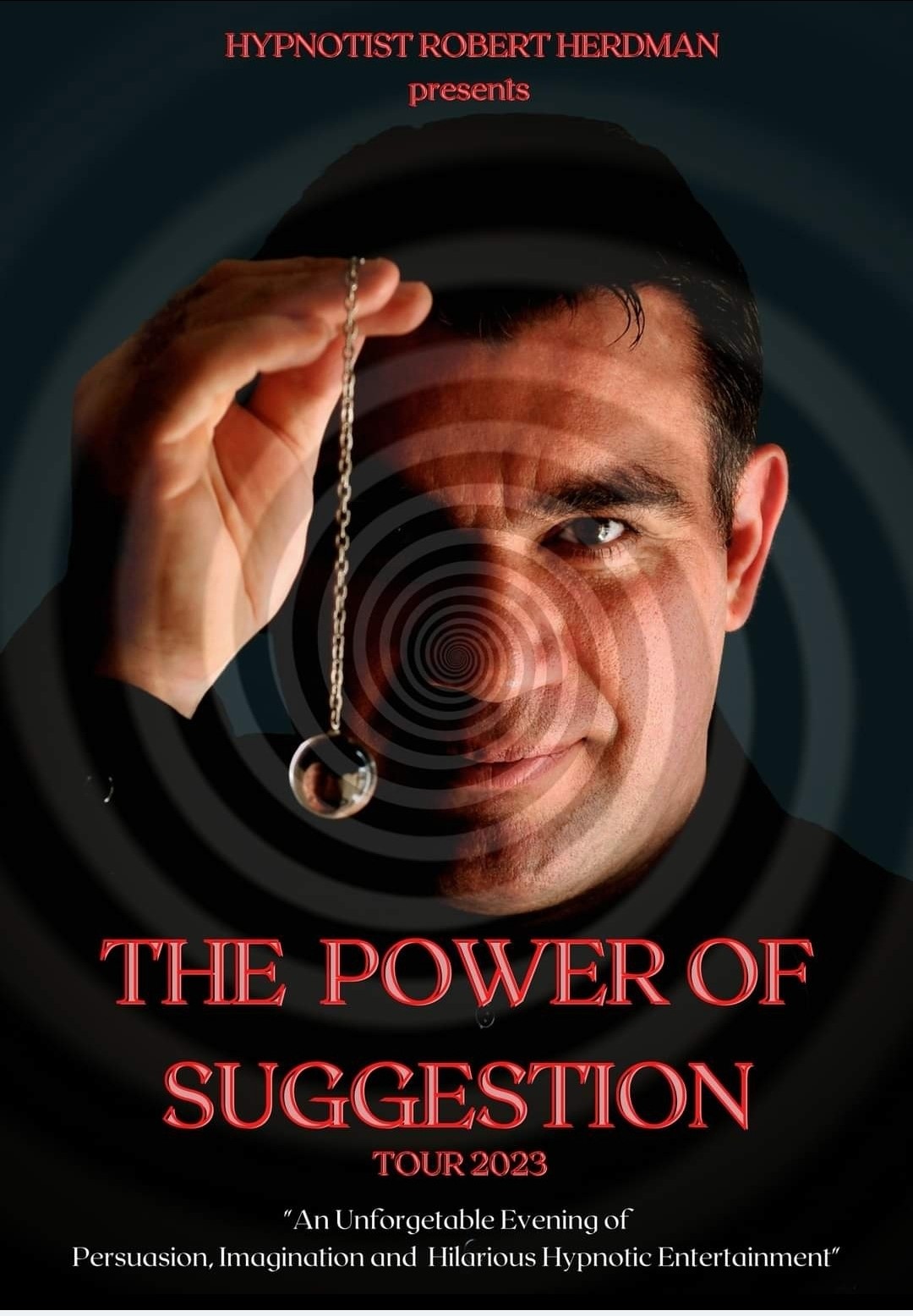 An intense looking man with a crystal hanging from a chain.